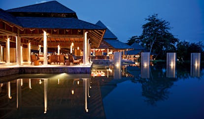 Constance Ephelia Resort Seychelles outdoor terrace pavilion outdoor pool night time