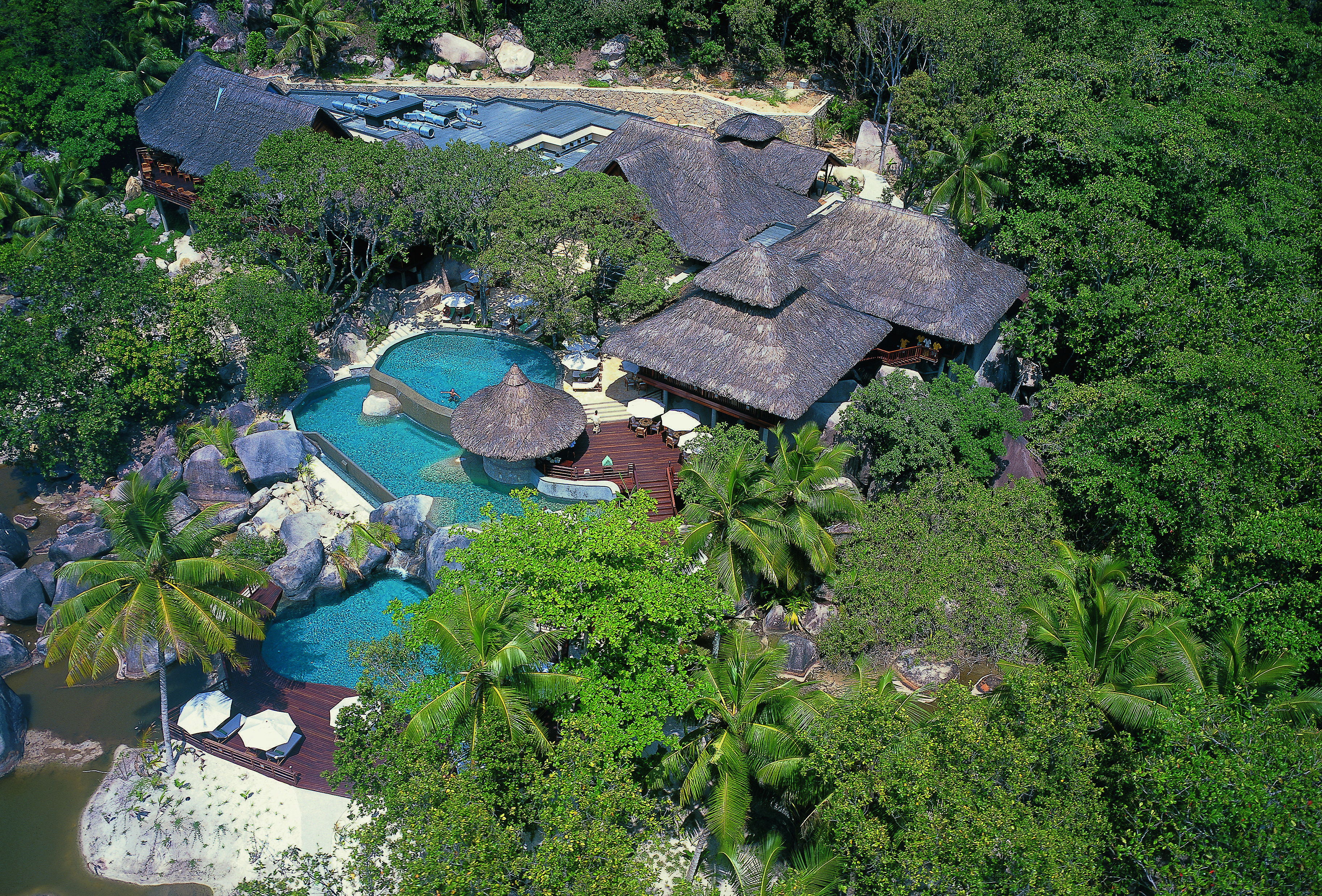 Constance Lemuria Seychelles aerial view hotel complex forest outdoor pools