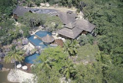 Constance Lemuria Seychelles aerial view hotel complex forest outdoor pools