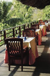 Constance Lemuria Seychelles balcony dining deck greenery