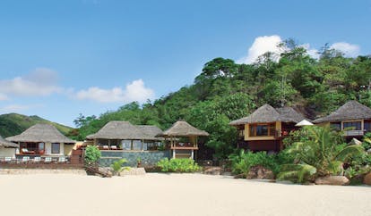 Constance Lemuria Seychelles bungalow beach thatched roofed villas forests