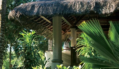Constance Lemuria Seychelles hut restaurant exterior chef preparing food in a pavilion