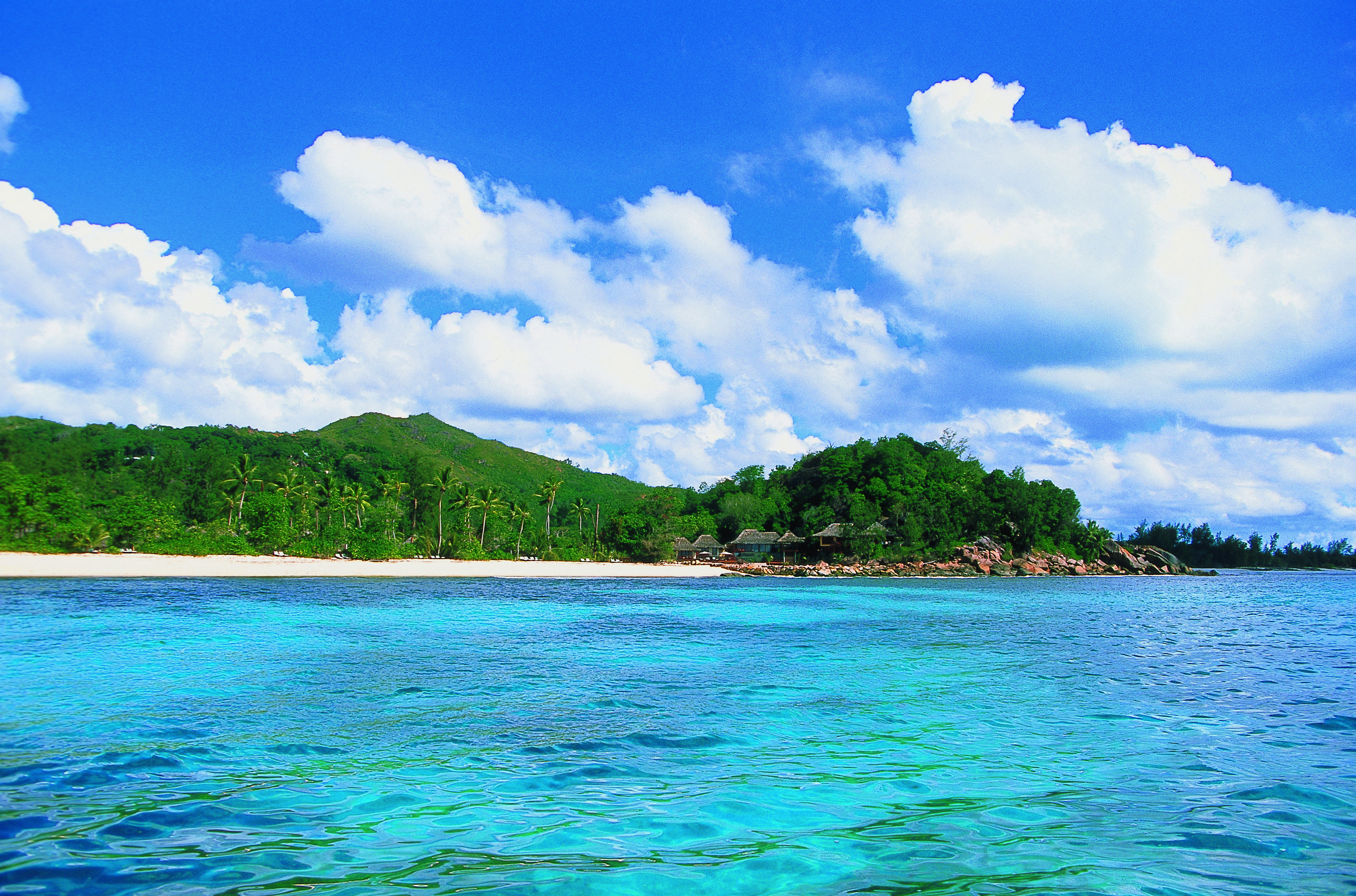 Constance Lemuria Seychelles island view forest beach thatched buildings