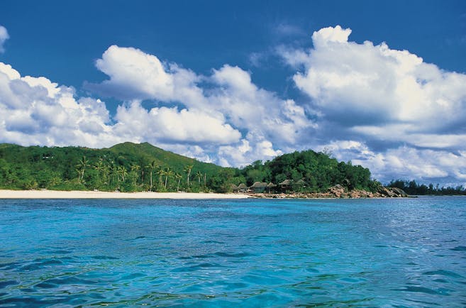 Constance Lemuria Seychelles island view forest beach thatched buildings