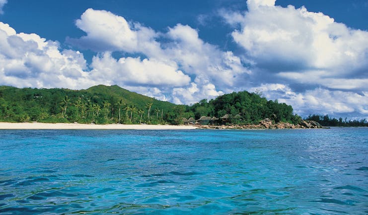 Constance Lemuria Seychelles island view forest beach thatched buildings