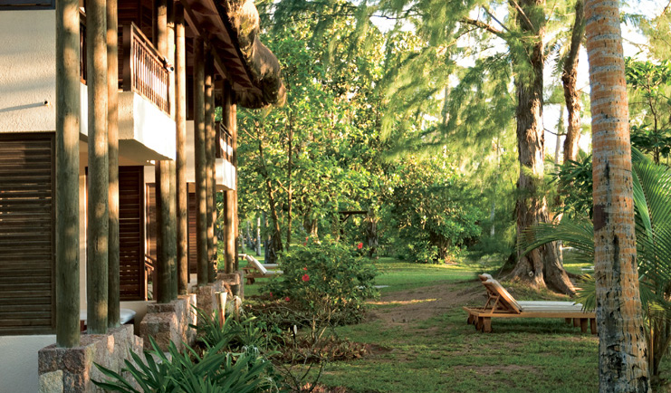 Constance Lemuria Seychelles junior suite garden sun loungers trees
