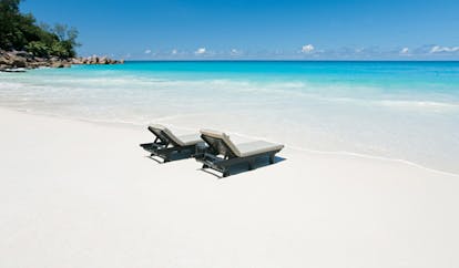 Constance Lemuria Seychelles private beach white sand loungers