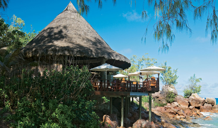 Constance Lemuria Seychelles restaurant view thatched pavilion balcony over ocean