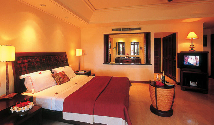 Constance Lemuria Seychelles sensuite bedroom tropical flowers minimalist decor wine