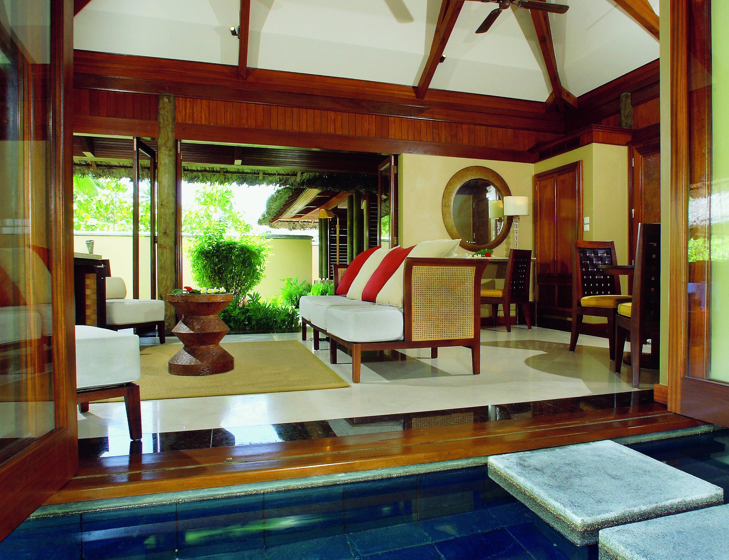 Constance Lemuria Seychelles villa lounge sofas stepping stone into pool