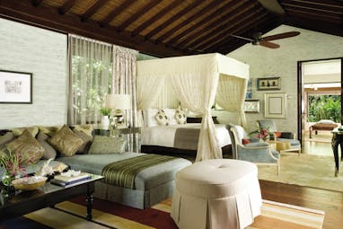 Ocean View vila with large four poster bed with drapes and seating areas