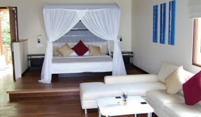 Hilton Labriz Seychelles ocean pavilion bedroom four poster beds lounge area