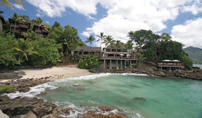 Hilton Northolme Seychelles beach palm trees villas