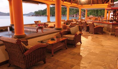 Domaine de la Reserve Seychelles bar pavilion fountain wicker seating ocean view