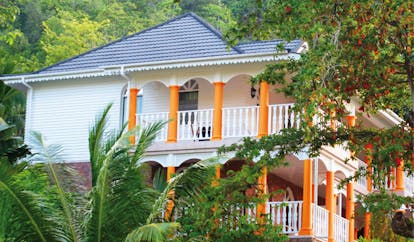 Domaine de la Reserve Seychelles building exterior villa with orange columns