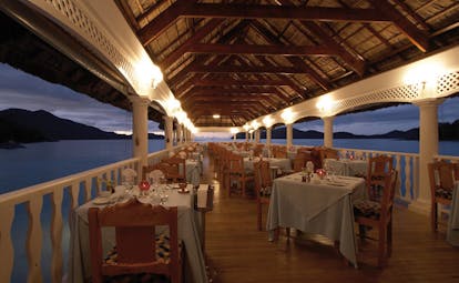 Domaine de la Reserve Seychelles jetty dining area ocean and island view sunset