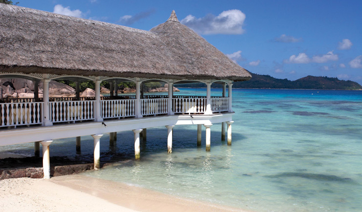 Domaine de la Reserve Seychelles jetty into ocean with thatched roof