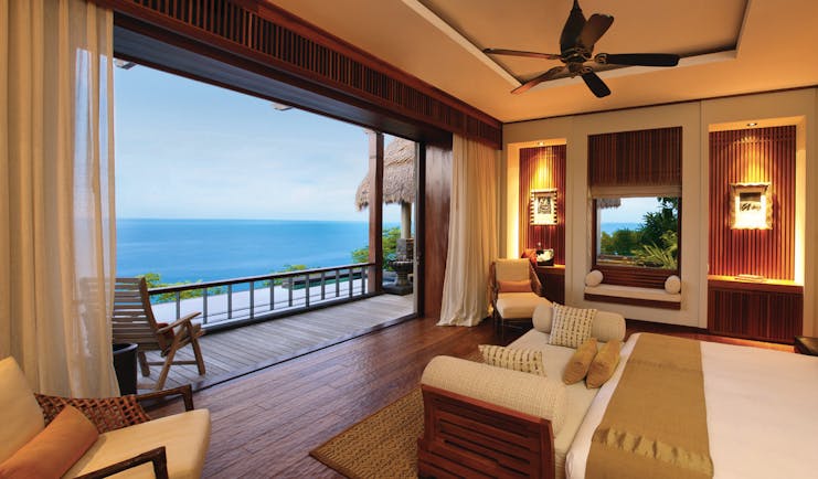 Maia Seychelles villa lounge area modern décor terrace overlooking ocean