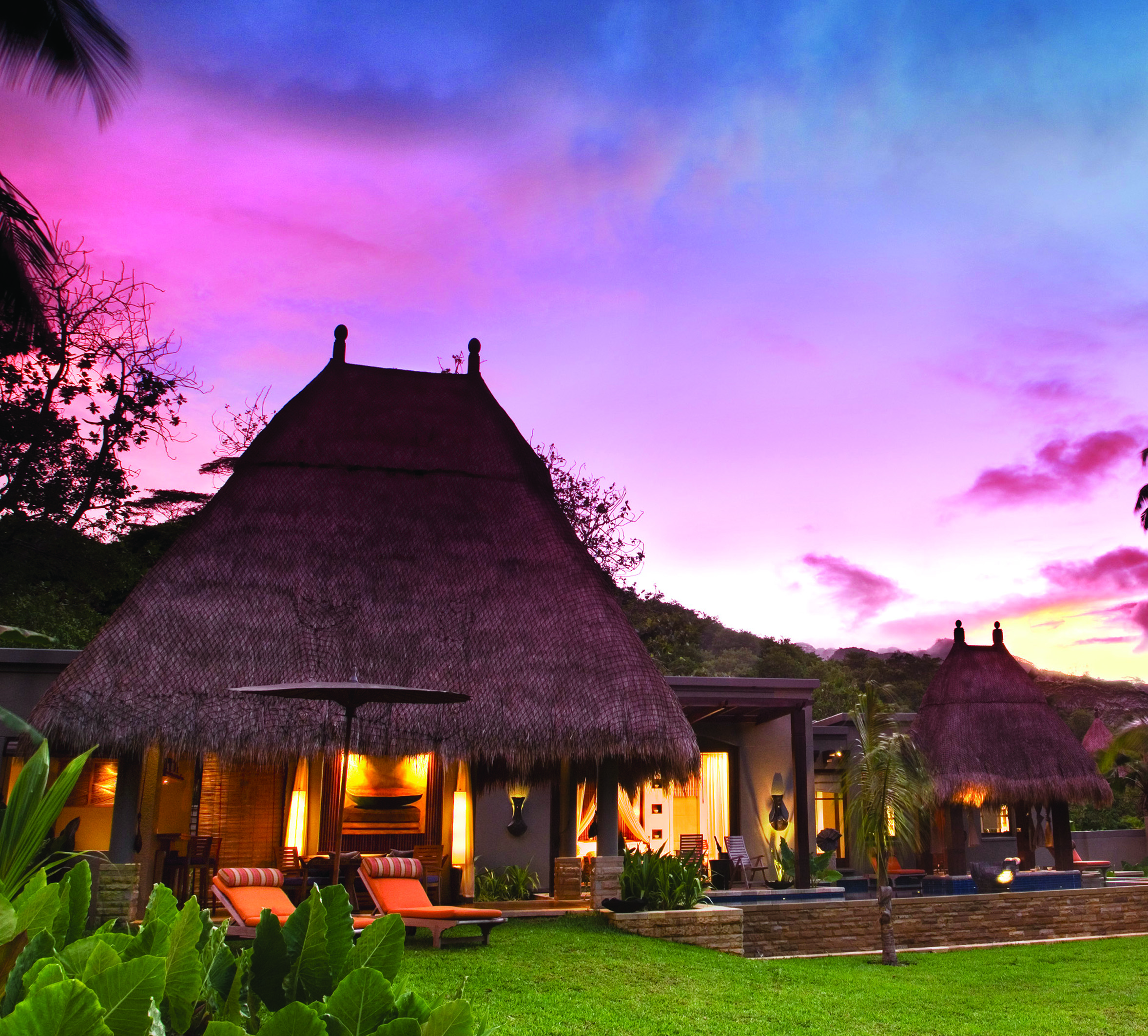 Maia Seychelles villa exterior sun loungers lawn gardens terrace