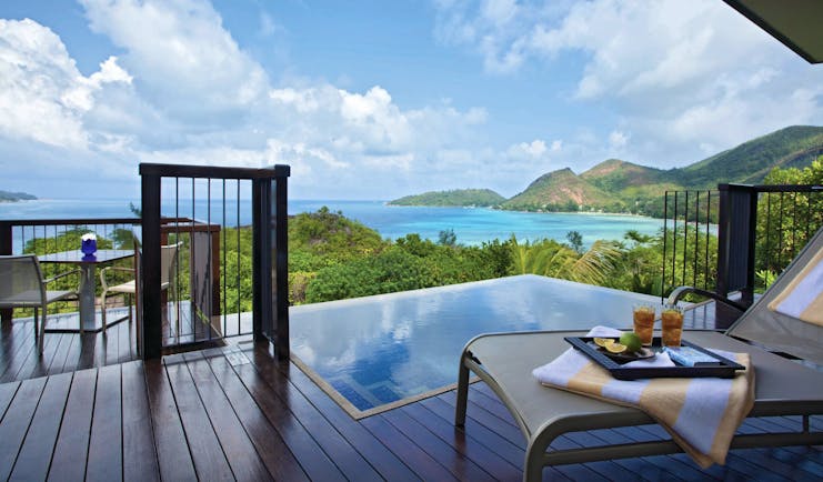 Raffles Praslin ocean view villa terrace with private plunge pool, sun lounger, views over the ocean