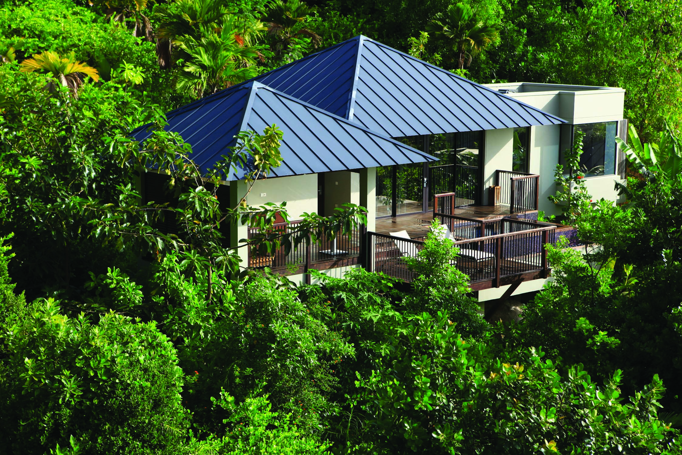 Raffles Praslin pool villa exterior, villa with terrace nestled amongst tropical greenery