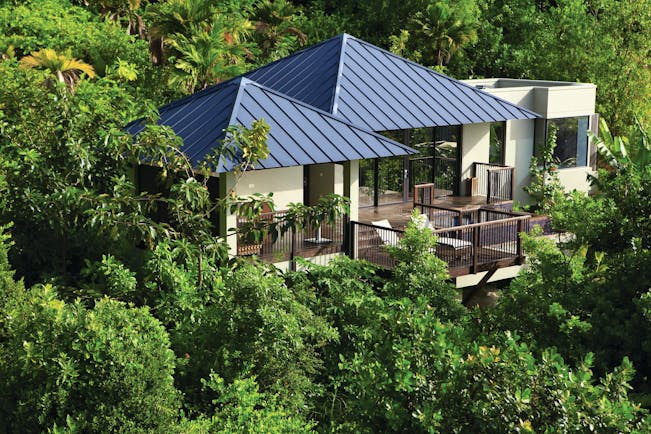 Raffles Praslin pool villa exterior, villa with terrace nestled amongst tropical greenery