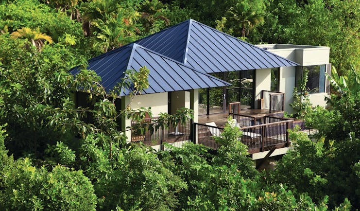 Raffles Praslin pool villa exterior, villa with terrace nestled amongst tropical greenery