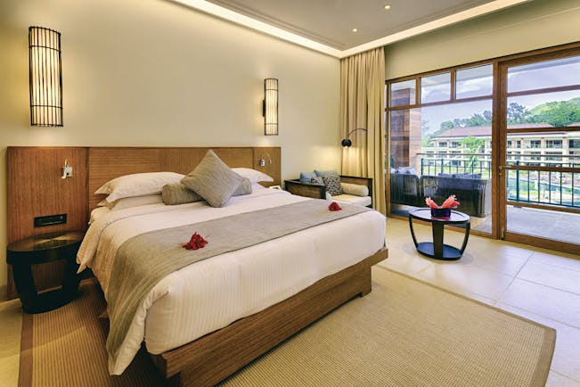 Savoy Seychelles standard room, double bed, access to balcony, bright modern decor