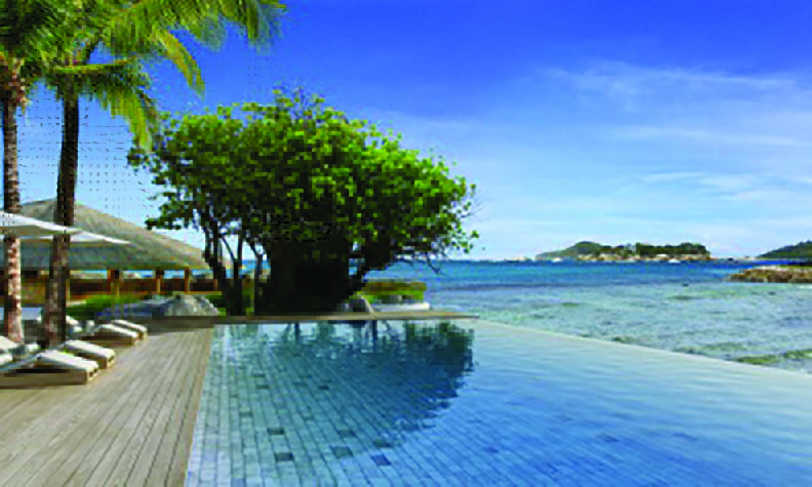 Six Senses Zil Pasyon infinity pool, wooden decking overlooking sea
