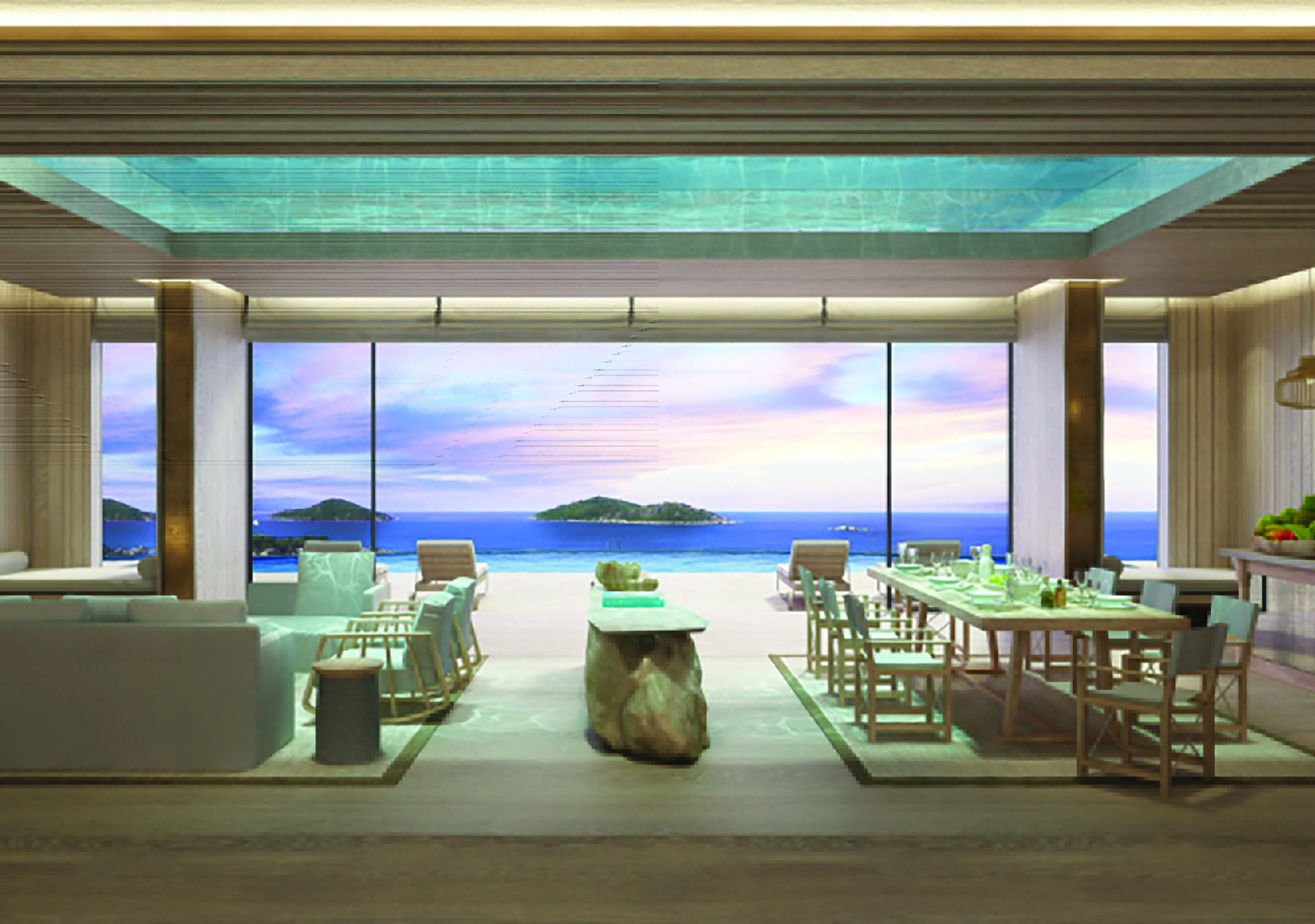 Six Senses Zil Pasyon residence lounge, modern decor, large dining table and sofa, glass walls with views across the ocean to adjacent islands