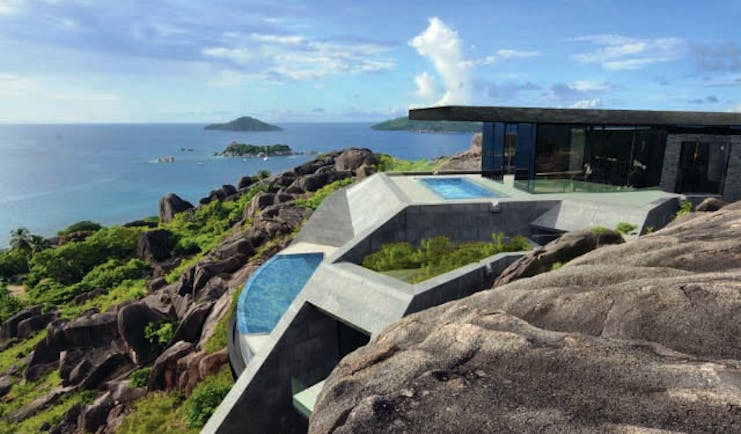 Six Senses Zil Pasyon residence, cliffside building with private pools and views out to sea