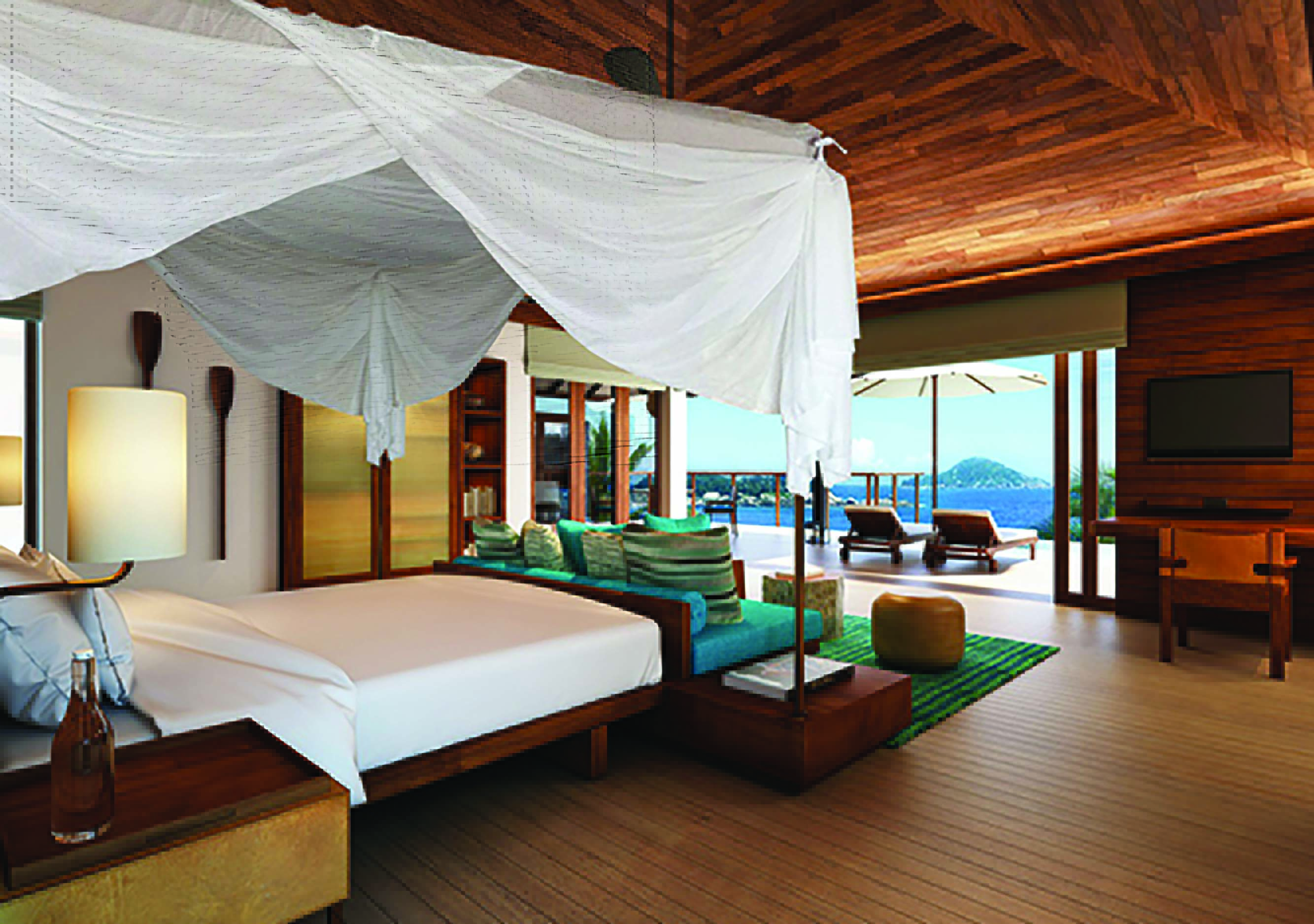 Six Senses Zil Pasyon villa bedroom, bed, sofa, fresh modern decor, terrace with sun loungers and ocean views
