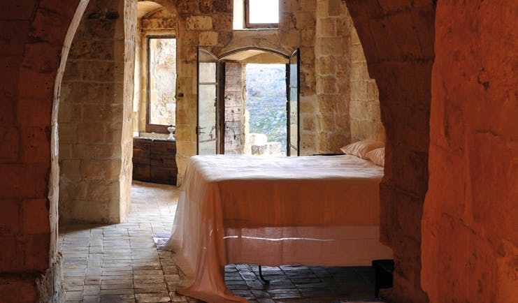 Sextantio Albergo Diffuso Abruzzo guestroom bed authentic architecture
