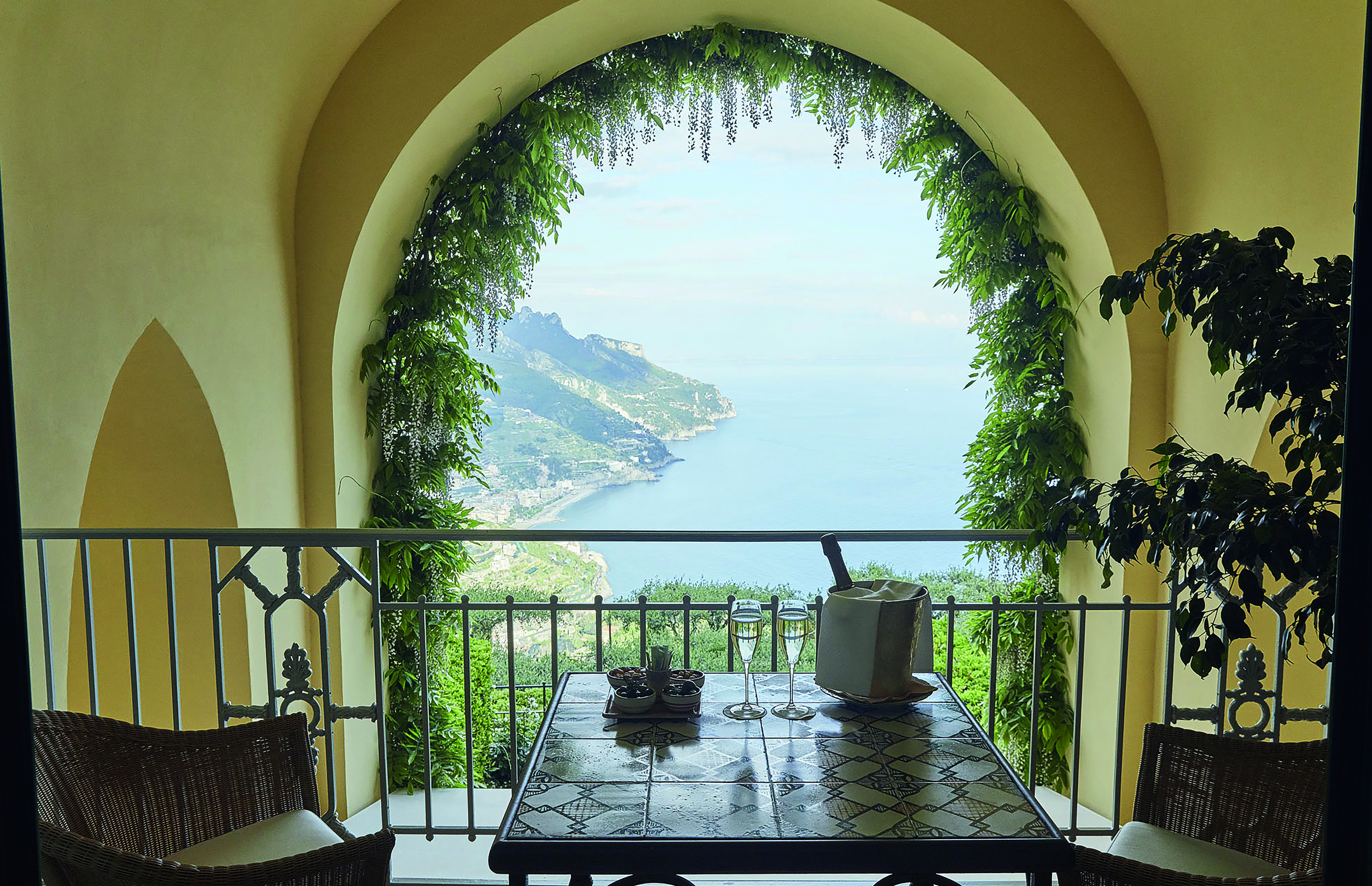 Hotel Caruso Amalfi Coast indoor balcony seating area champagne overlooking the coast line