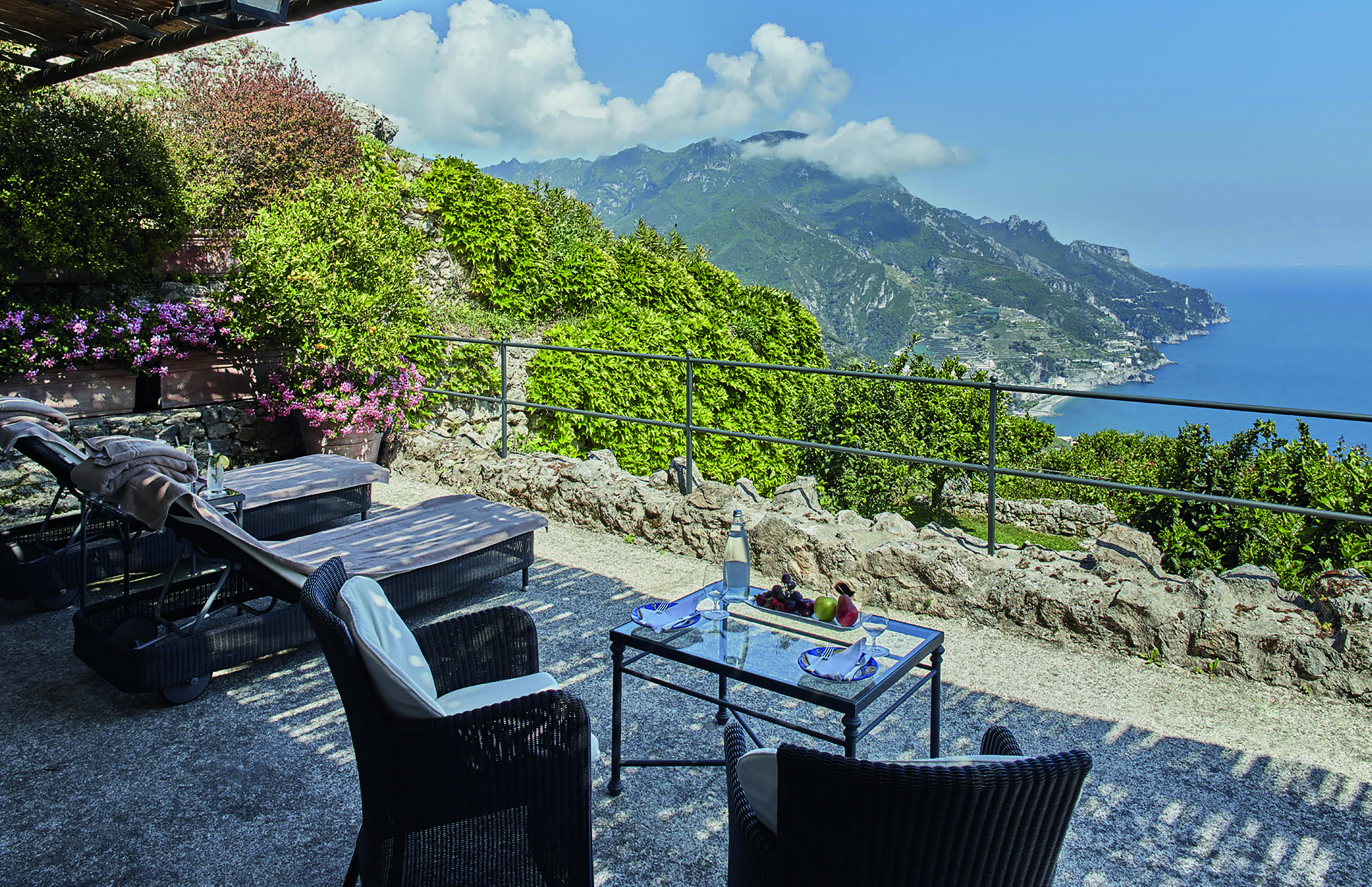 Hotel Caruso Amalfi Coast terrace in the cliffside outdoor seating area overlooking the coast line