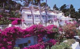 Casa Morgano Amalfi Coast exterior hotel building pink flowers trees terrace