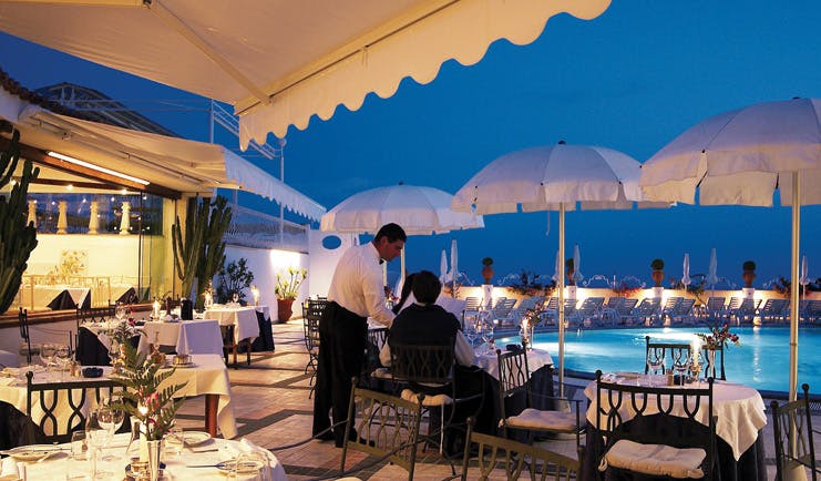Hotel Quisisana Capri poolside dining tables umbrellas waiter