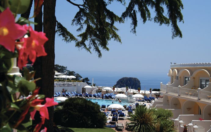 Hotel Quisisana Capri poolside sun loungers umbrellas sea in background