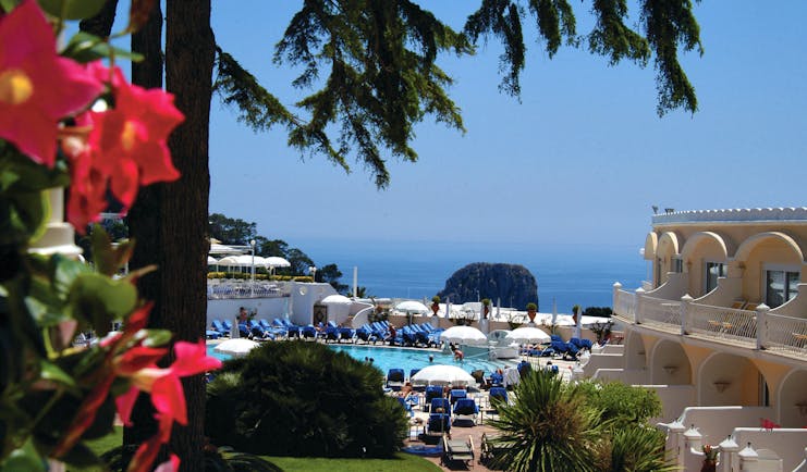Hotel Quisisana Capri poolside sun loungers umbrellas sea in background