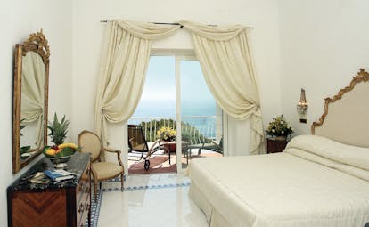 Hotel Quisisana Capri special deluxe room bed private terrace overlooking sea elegant décor