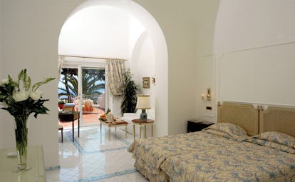 Hotel Quisisana Capri suite bed lounge area access to private terrace elegant décor