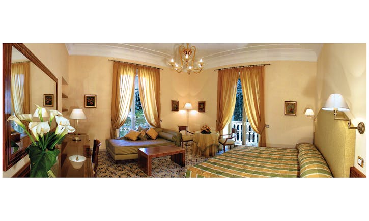 Hotel Antiche Mura Amalfi Coast junior suite bed seating area small table