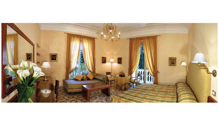 Hotel Antiche Mura Amalfi Coast junior suite bed seating area small table