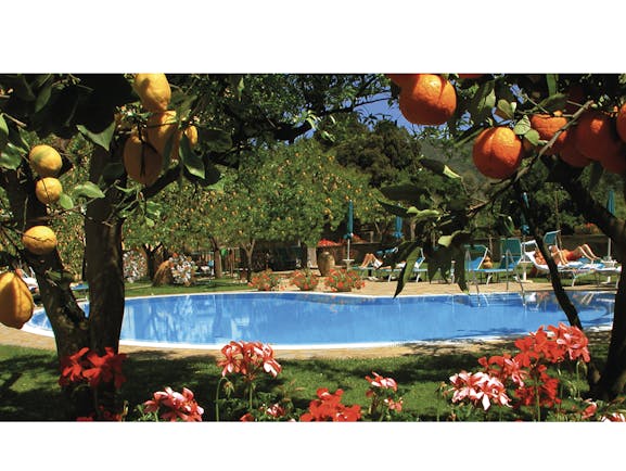 Hotel Antiche Mura Amalfi Coast pool sun loungers lemon trees orange trees