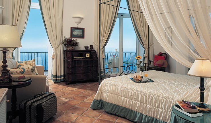Caesar Augustus Amalfi Coast guest room bed sofa elegant décor sea views