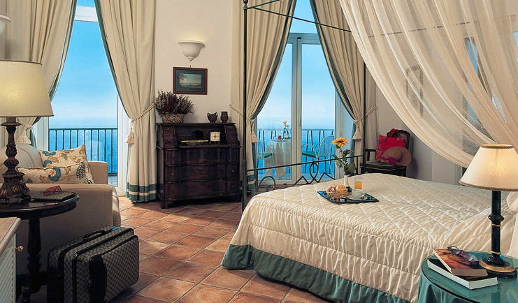 Caesar Augustus Amalfi Coast guest room bed sofa elegant décor sea views
