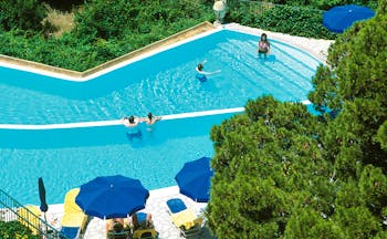 Caesar Augustus Amalfi Coast pool sun loungers umbrellas people playing in water