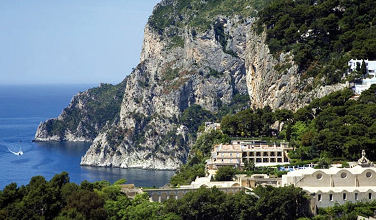 Hotel Luna Capri cliffs coastline boat on water