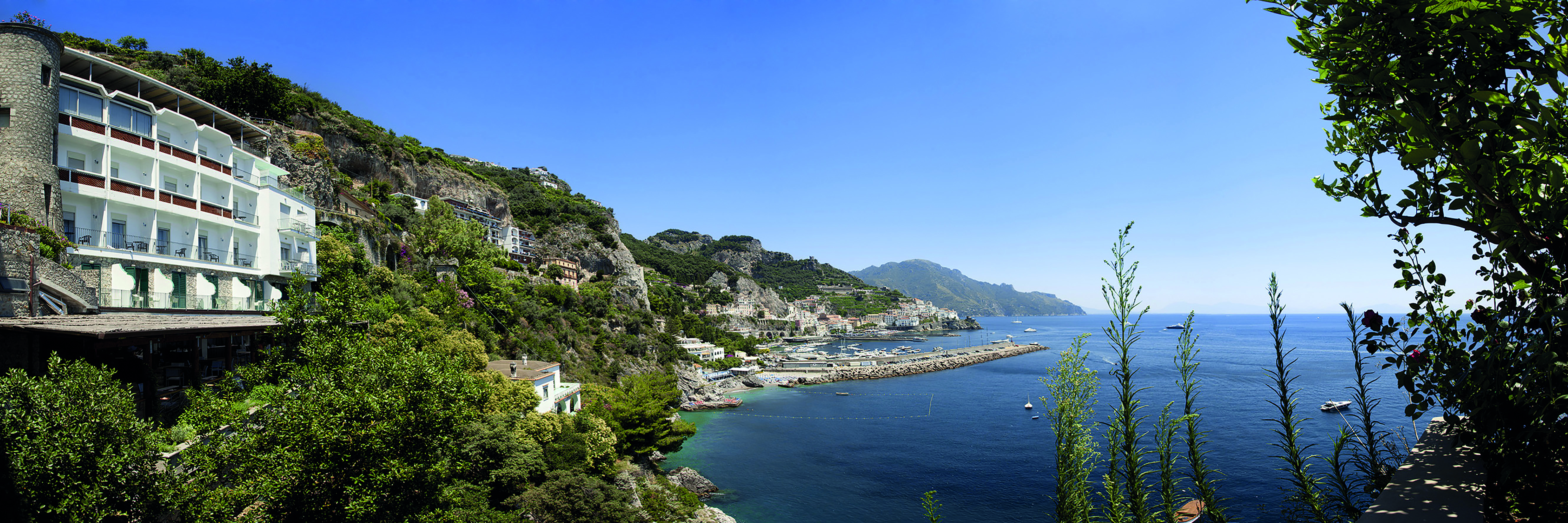 Hotel Miramalfi Amalfi Coast exterior building nestled into cliffside overlooking sea