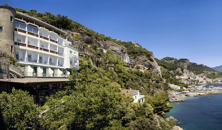 Hotel Miramalfi Amalfi Coast exterior building nestled into cliffside overlooking sea